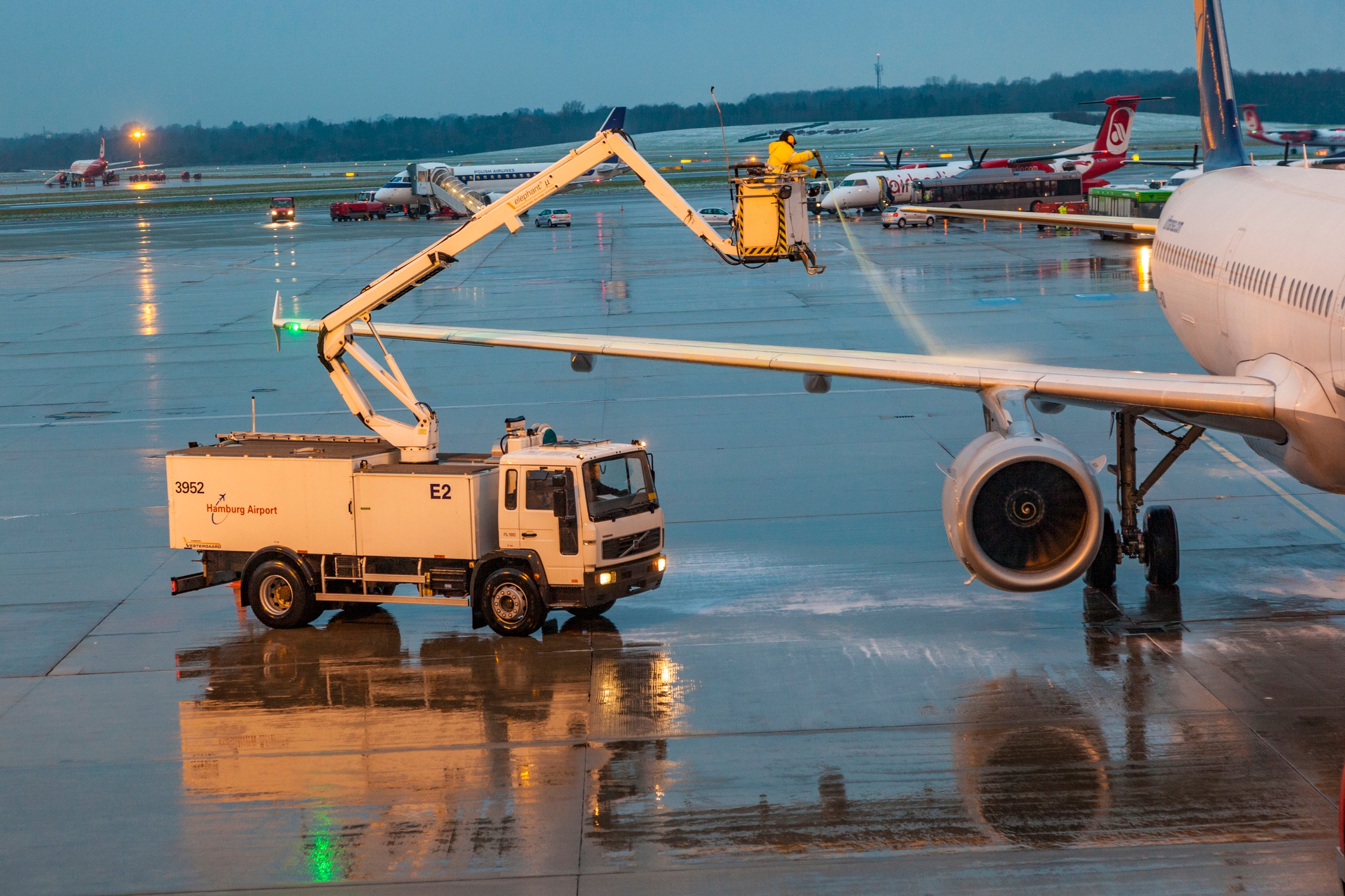 Picture of an airplane deicing with a water and glycol mixture
